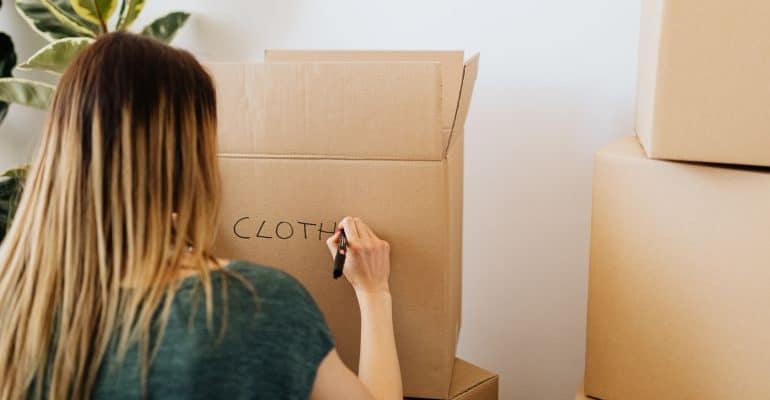 Woman labeling a moving box