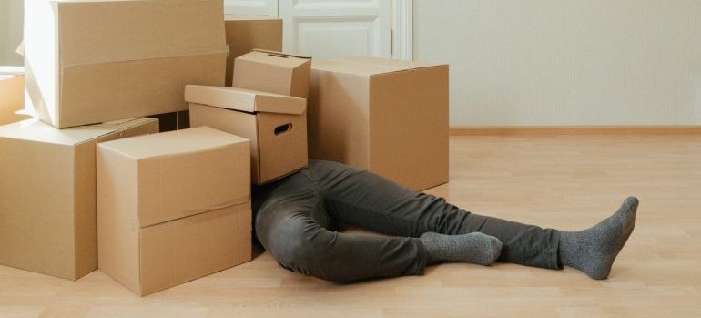 person with moving boxes