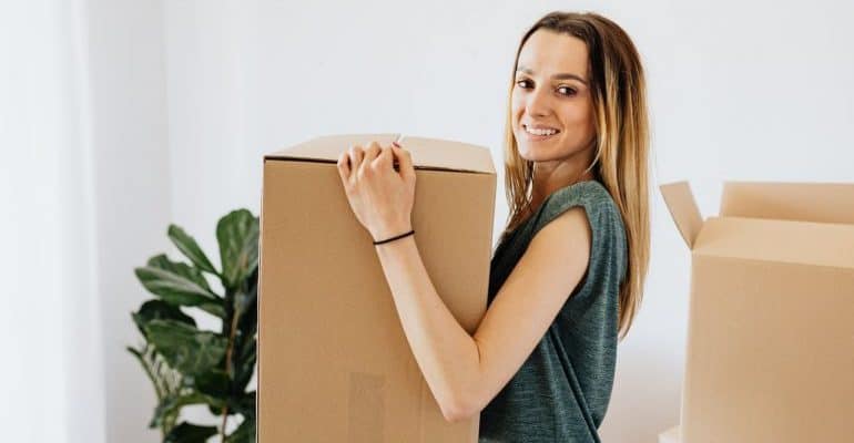 Girl carrying a box