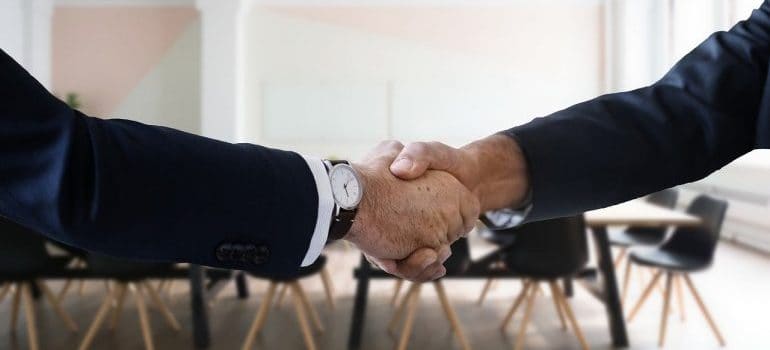 A handshake between two businessmen.