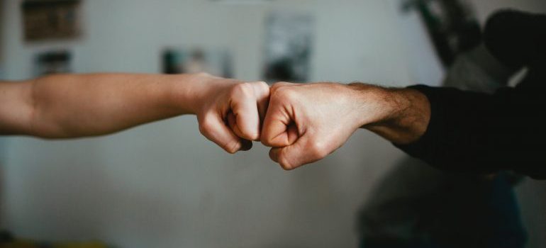 Greeting with fists