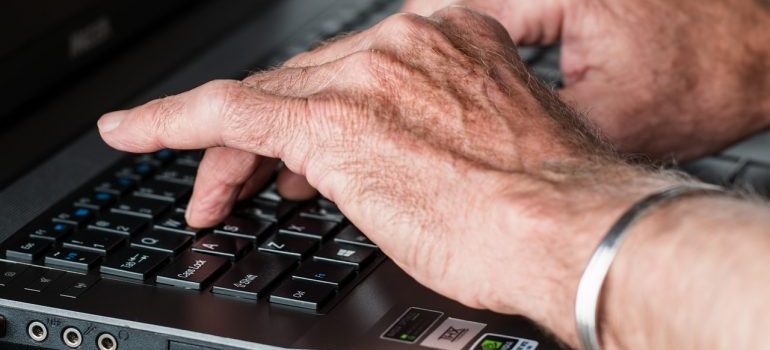 Senior typing on a computer