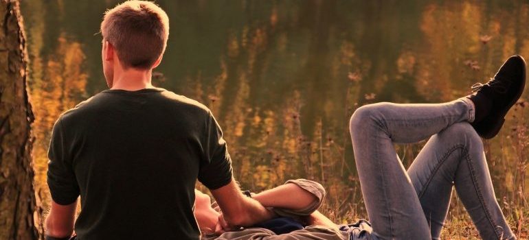 A man and a woman enjoying in the wood