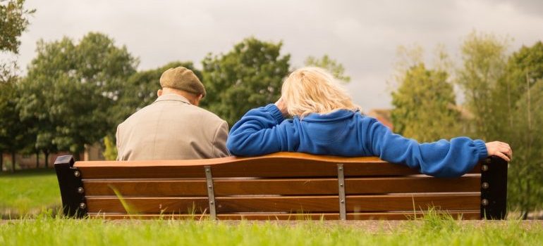 Elderly people sitting on a bench