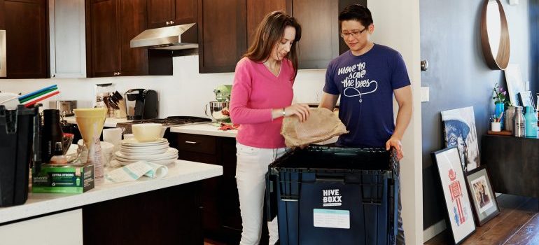 Woman and men loading the boxes