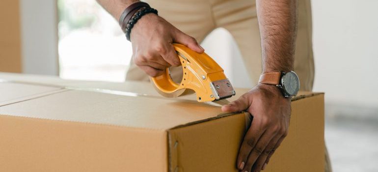 Taping the box as one of the proper packing methods