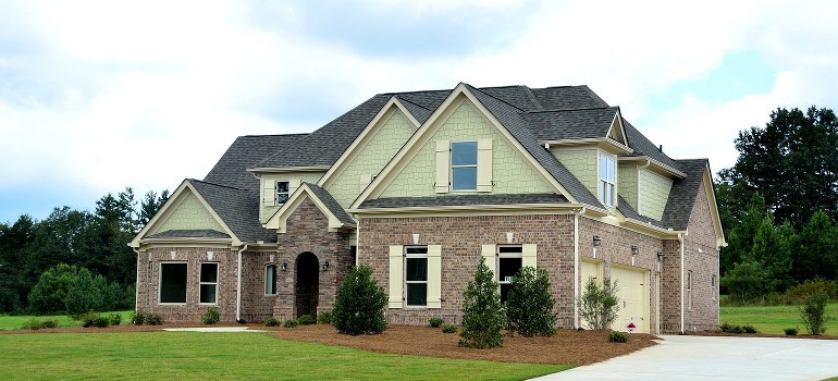 A large suburban home with a brick facade.