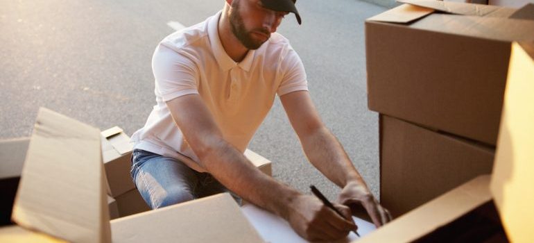 A movers writing something down