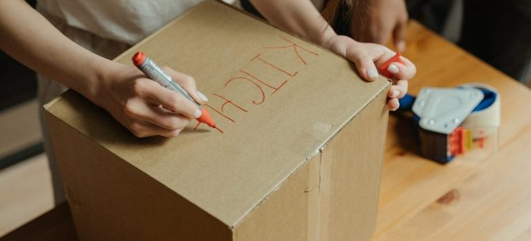 Labeling a moving box.