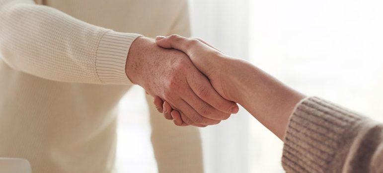 Two people shaking hands