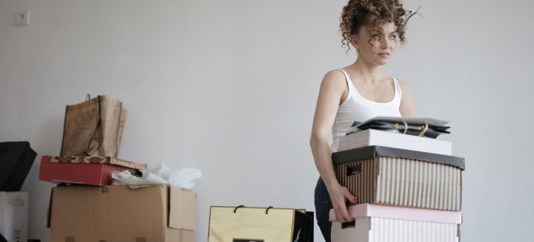 woman carrying the boxes